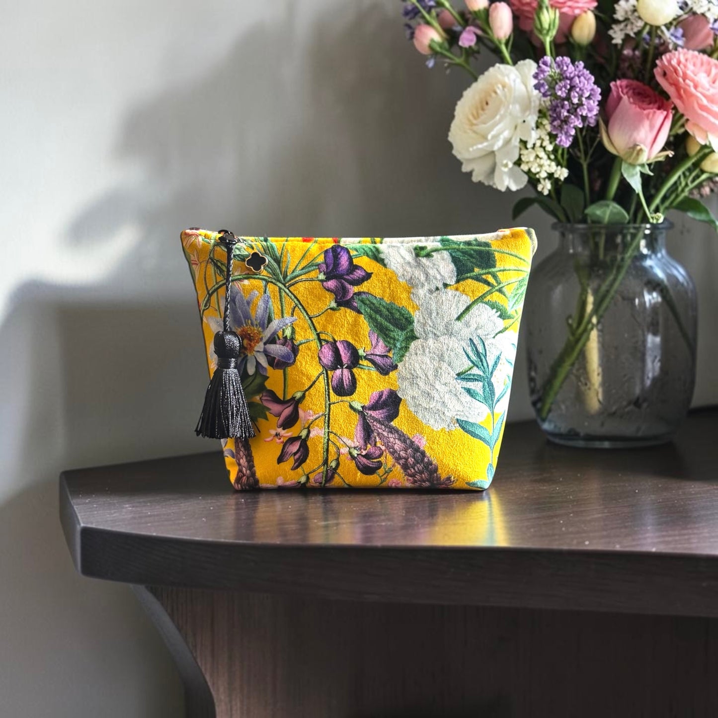 Yellow floral velvet small makeup bag with a black tassel and Red cotton lining.