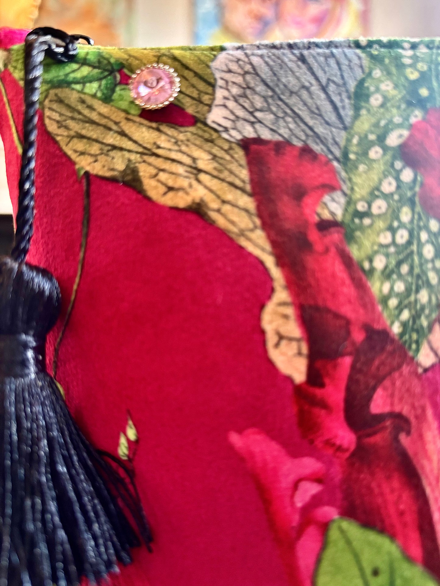 Cerise floral velvet small makeup bag with a black tassel. Handmade with red lining and diamanté pin button.
