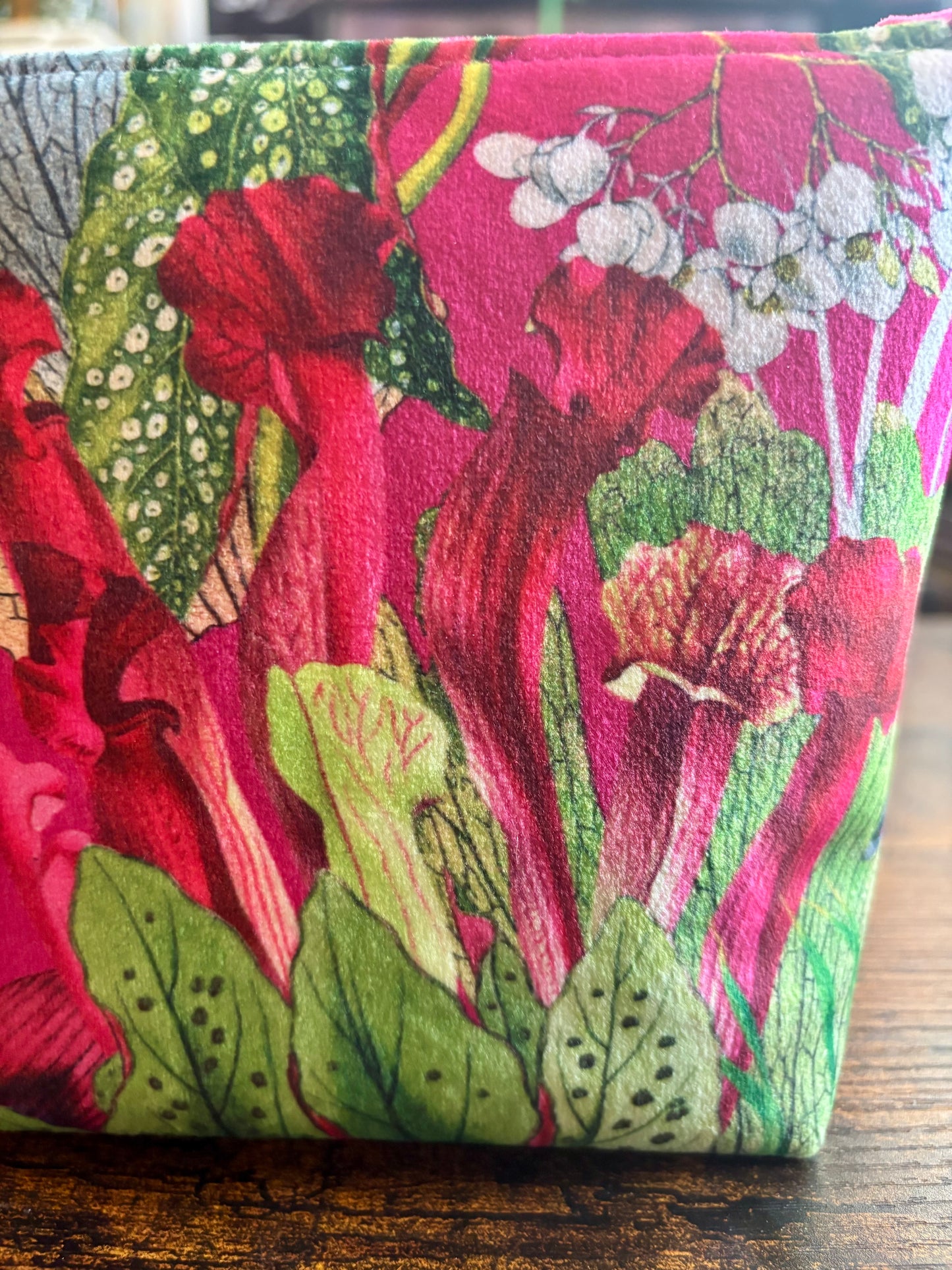 Cerise floral velvet small makeup bag with a black tassel. Handmade with red lining and diamanté pin button.