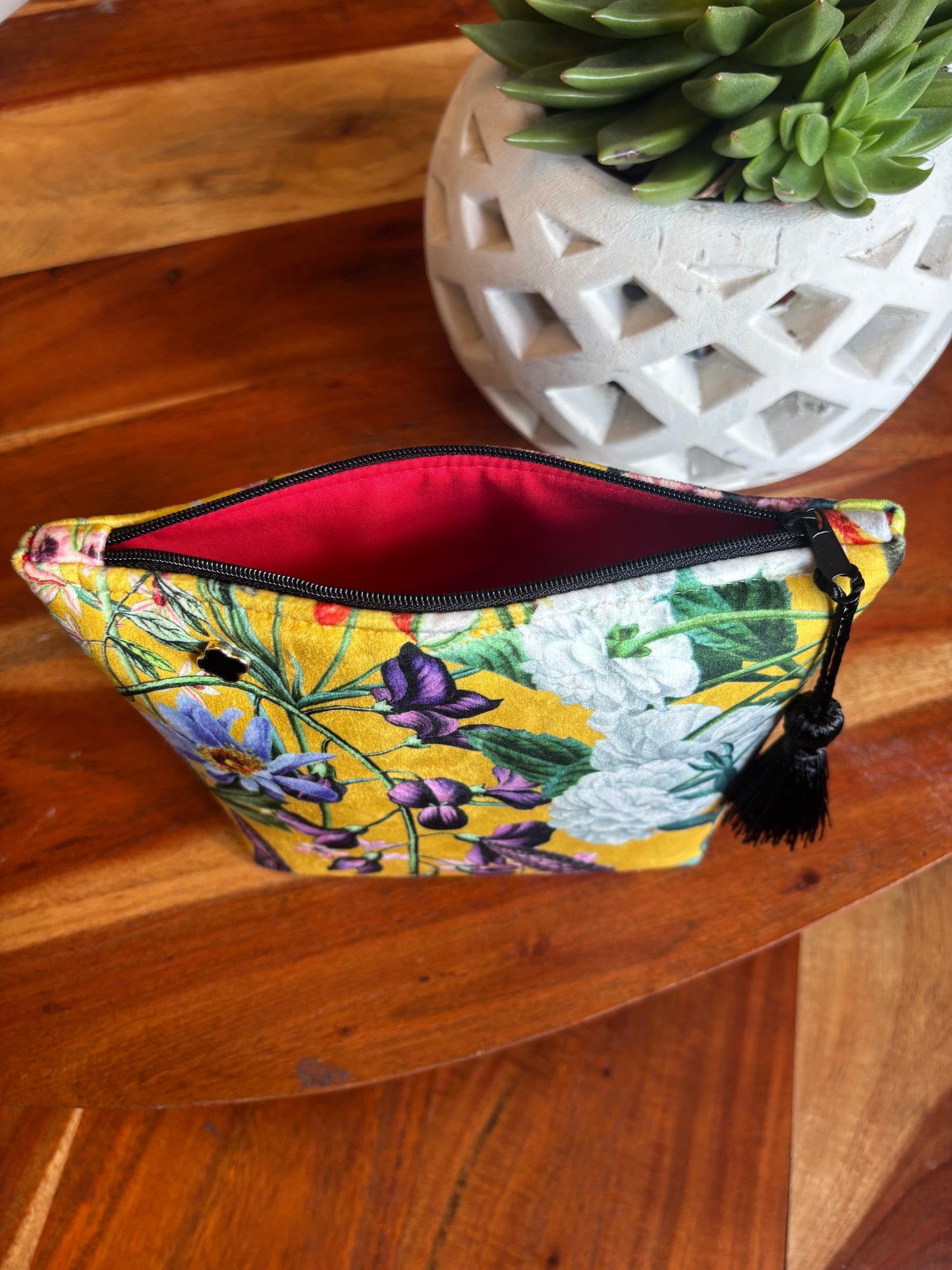 Yellow floral velvet small makeup bag with a black tassel and Red cotton lining.