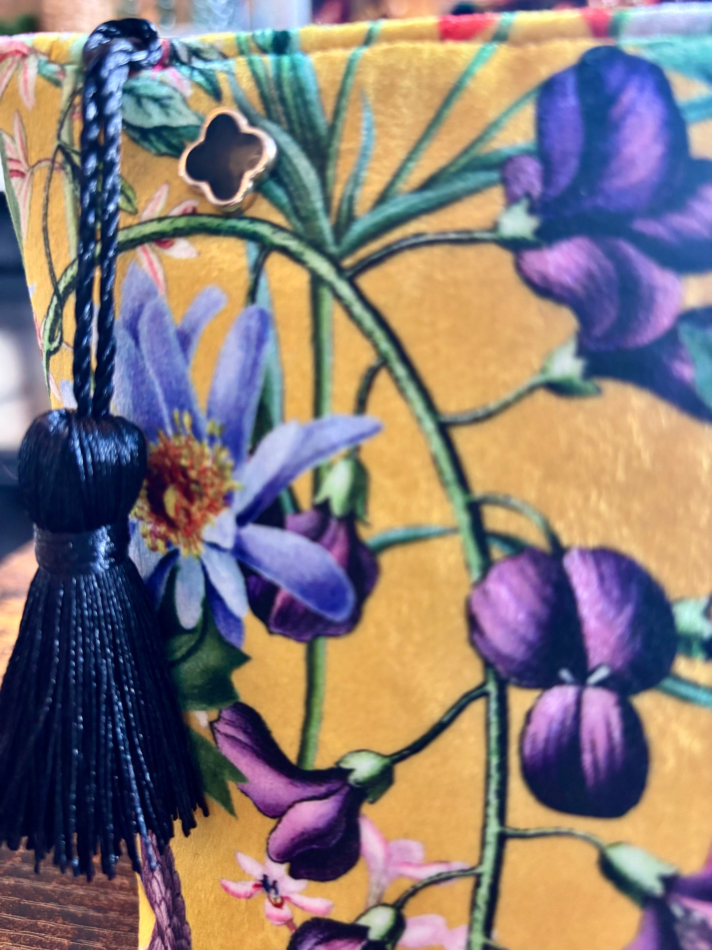 Yellow floral velvet small makeup bag with a black tassel and Red cotton lining.
