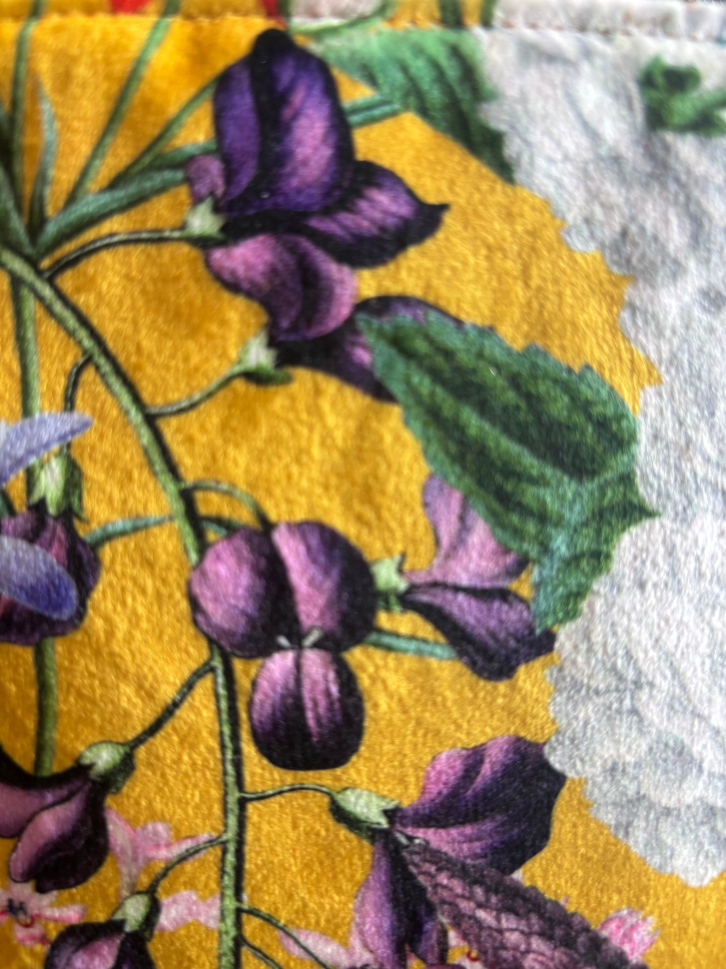 Yellow floral velvet small makeup bag with a black tassel and Red cotton lining.