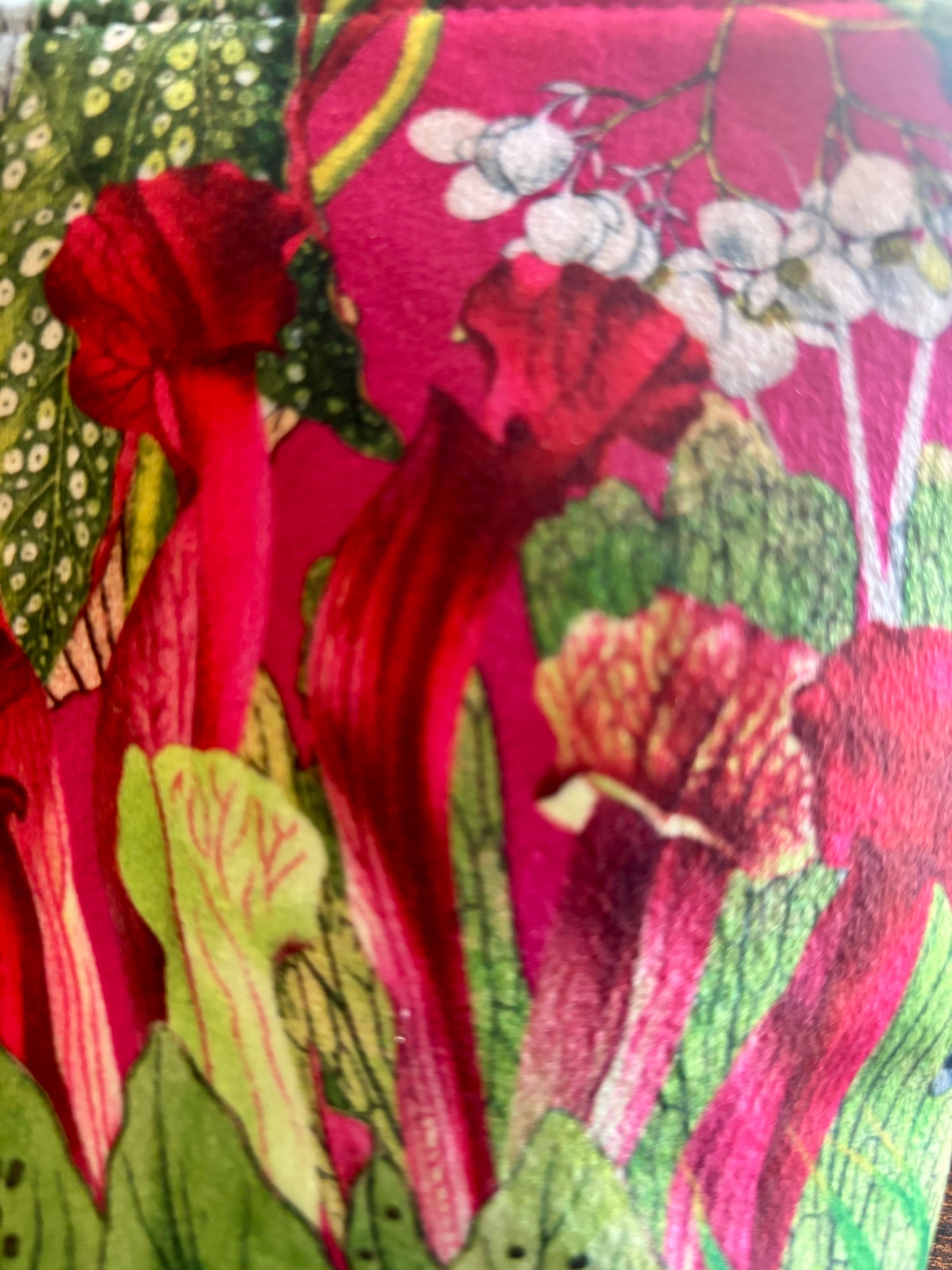 Cerise floral velvet small makeup bag with a black tassel. Handmade with red lining and diamanté pin button.